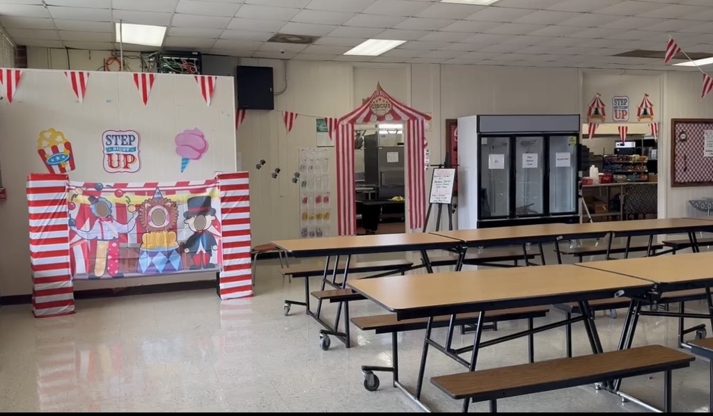 National School Lunch Week 2026- Cafeteria decorated in a circus theme with a "Step Right Up" area that has a place for students to place their heads in to take pictures