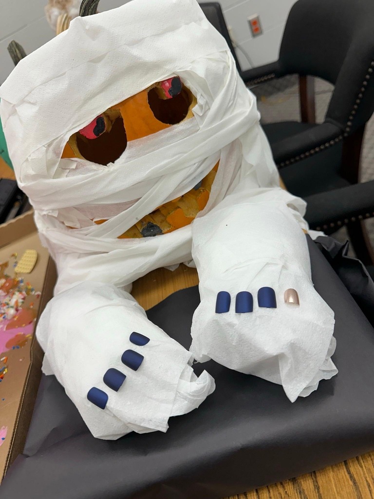 Rockingham County Middle pumpkin- An orange pumpkin wrapped in paper to look like a mummy