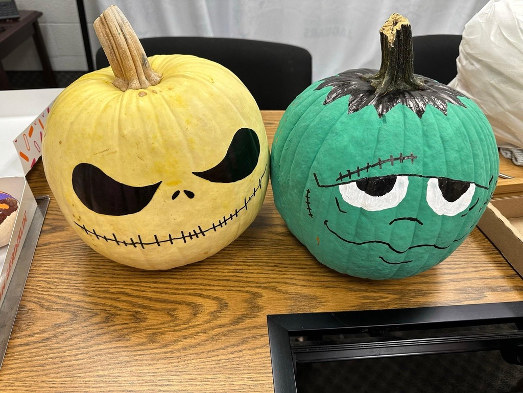 Rockingham County Middle pumpkin- One pumpkin painted yellow with a Jack Skeleton face and another painted green with a Frankenstein face