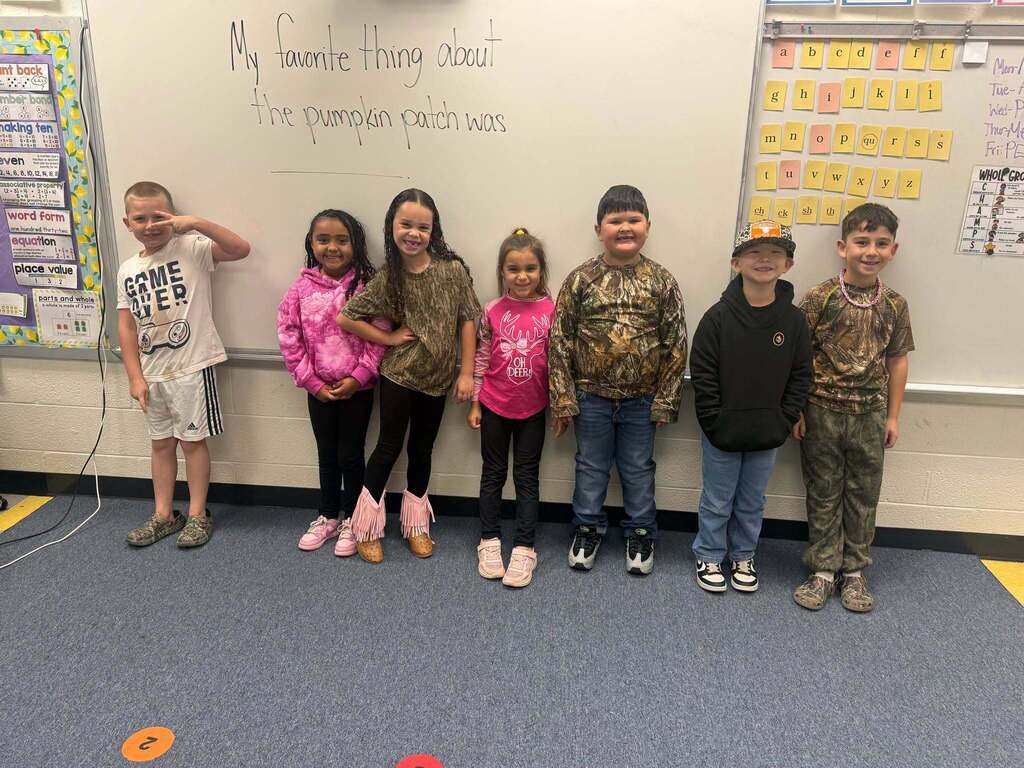 Red Ribbon Week- Lincoln Elementary Camo Day: 7 students (3 girls, 4 boys) all dressed in some form of camo. 2 are in pink