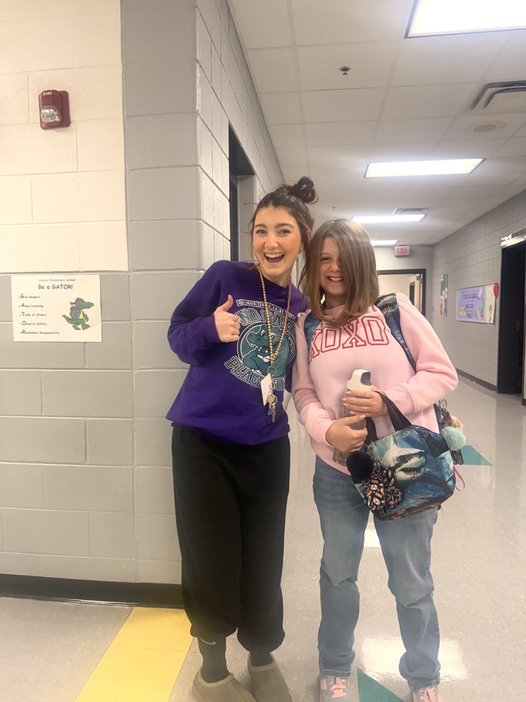 Red Ribbon Week- Lincoln Elementary Dress like a student/teacher day: A teacher and student posing in the hallway