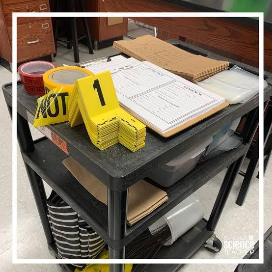 Rockingham County High School Public Safety class: A rolling table with shelves with evidence markers, crime scene tape, notebooks and other crime scene items