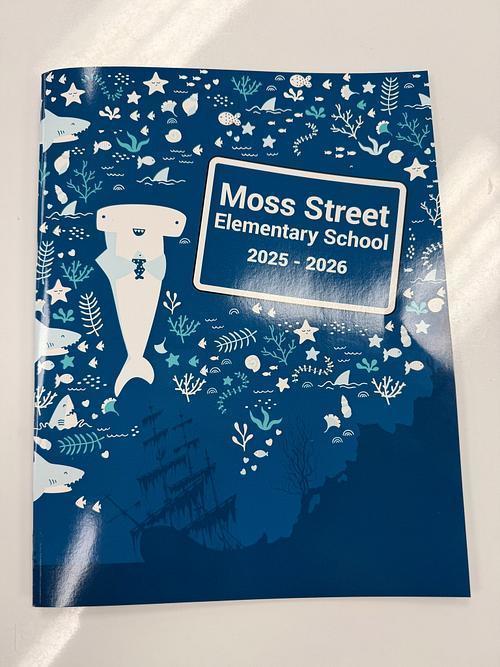 Yearbook with a shark on the cover
