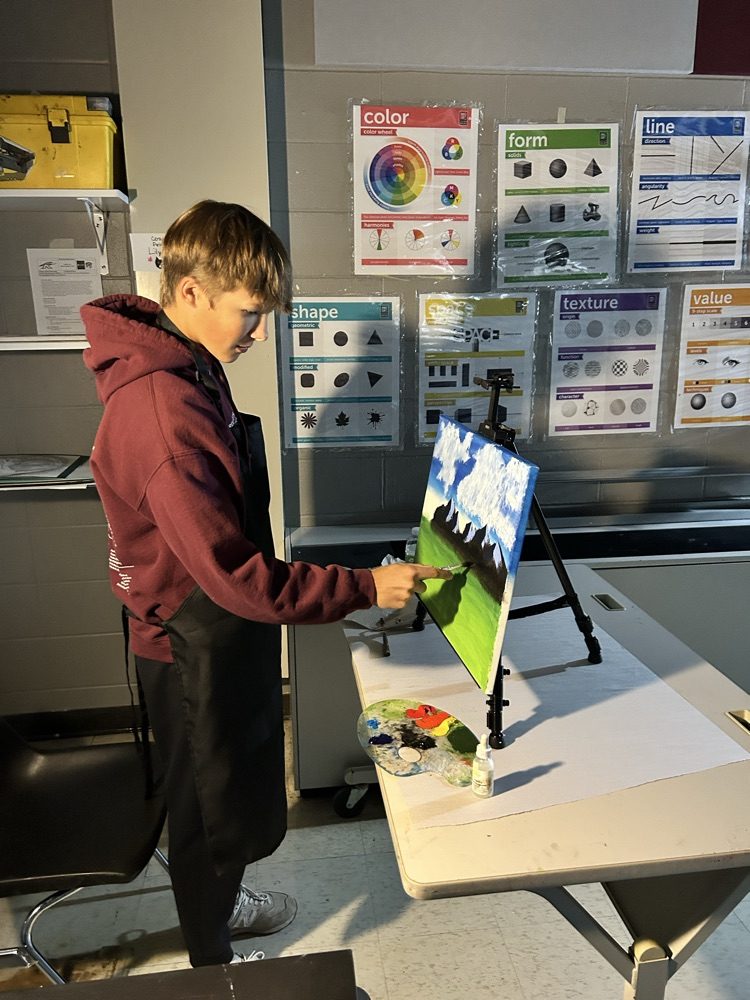 Quinten showing his love for oil painting!  He is in here all the time!