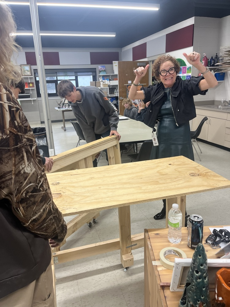 delivering the tables to the art department