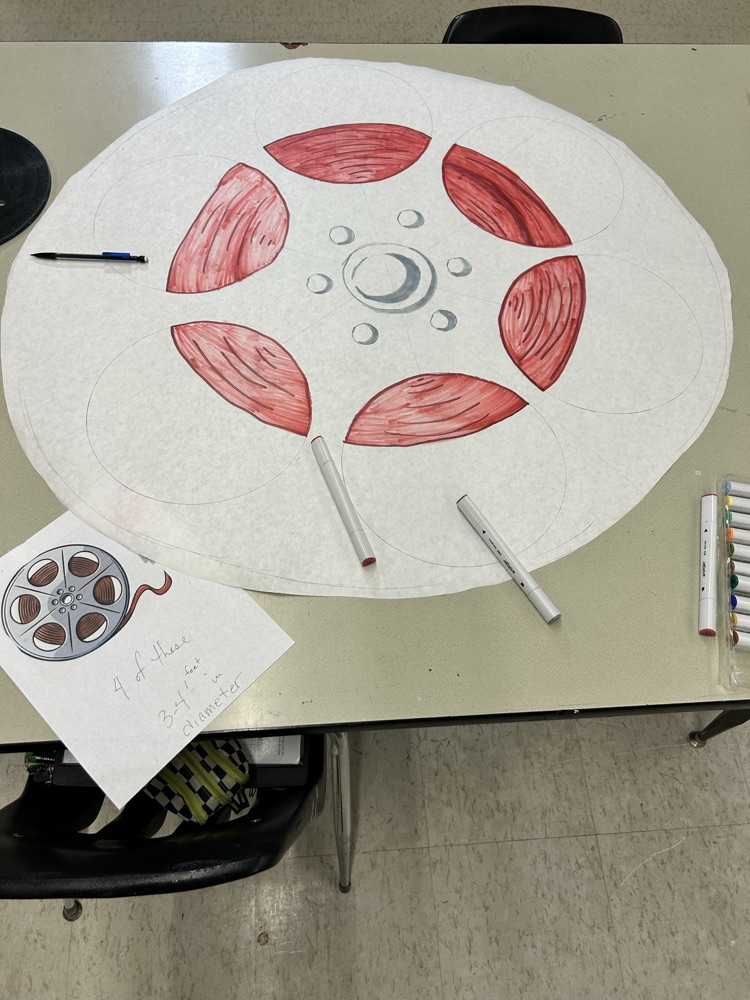 Lani is making props for the buses!