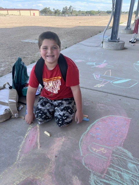Student with his Meloneer masterpiece
