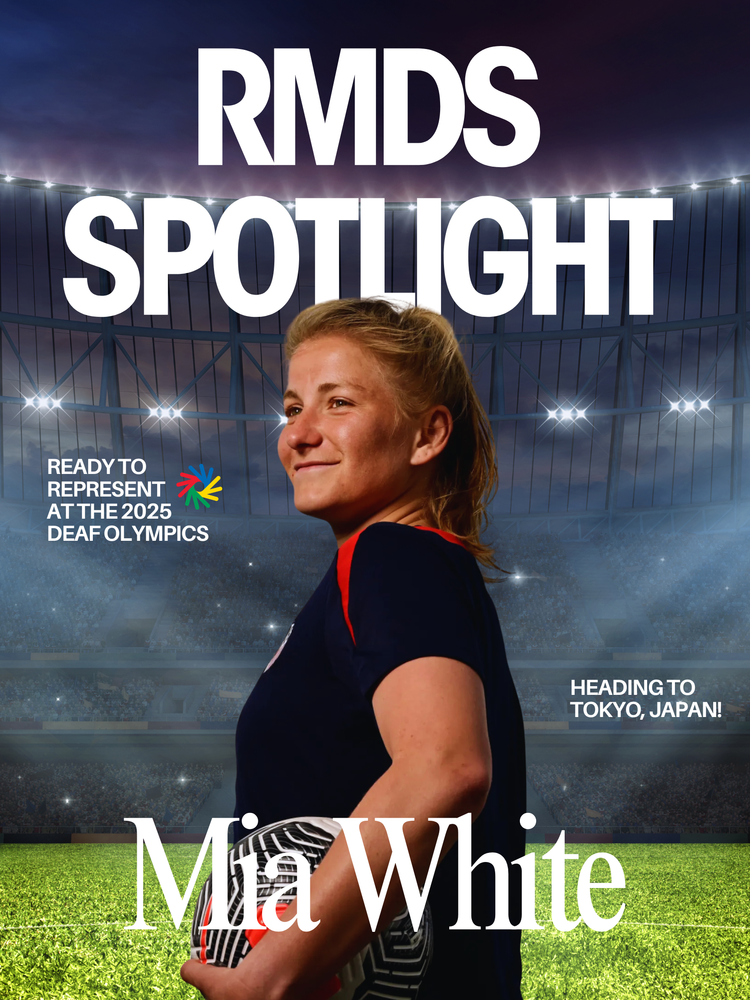 Alt text: A magazine-style cover titled “RMDS Spotlight” features a soccer player standing confidently in a brightly lit stadium at dusk. The player holds a soccer ball under one arm and looks determinedly into the distance. Text on the left reads “Ready to represent at the 2025 Deaf Olympics,” and on the right, “Heading to Tokyo, Japan!” The name “Mia White” appears prominently at the bottom.