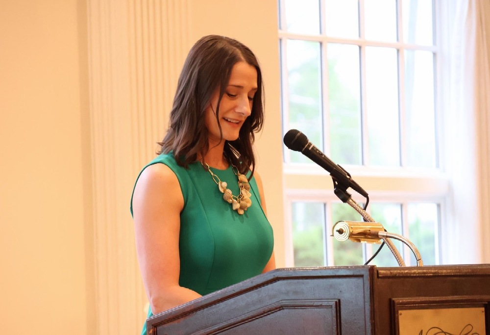 Amber Quirk standing at the podium