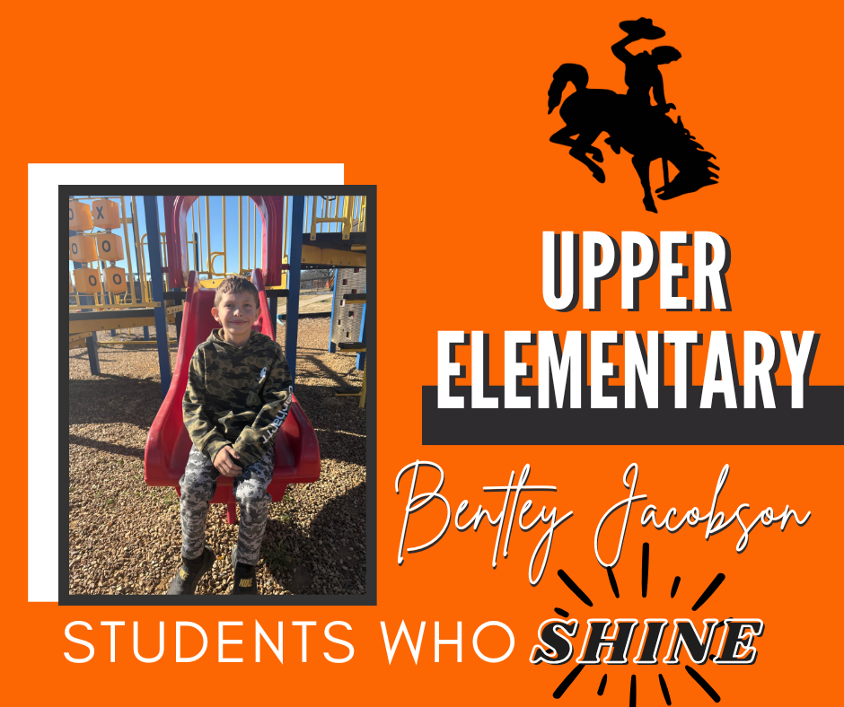 Upper Elementary students smiling while being recognized as January STAR Students at school.