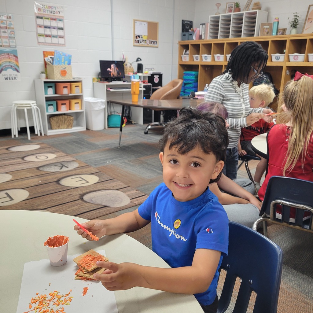 Roland High School culinary students work alongside lower elementary students to create Halloween-themed haunted houses. Students enjoy working together, decorating their houses, and getting creative with their designs.