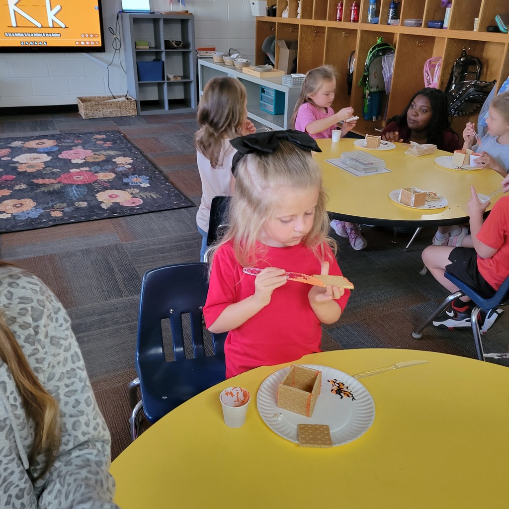 Roland High School culinary students work alongside lower elementary students to create Halloween-themed haunted houses. Students enjoy working together, decorating their houses, and getting creative with their designs.
