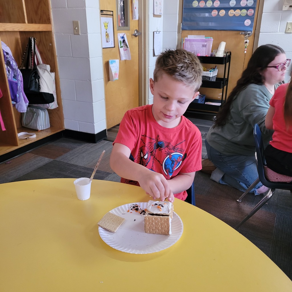 Roland High School culinary students work alongside lower elementary students to create Halloween-themed haunted houses. Students enjoy working together, decorating their houses, and getting creative with their designs.