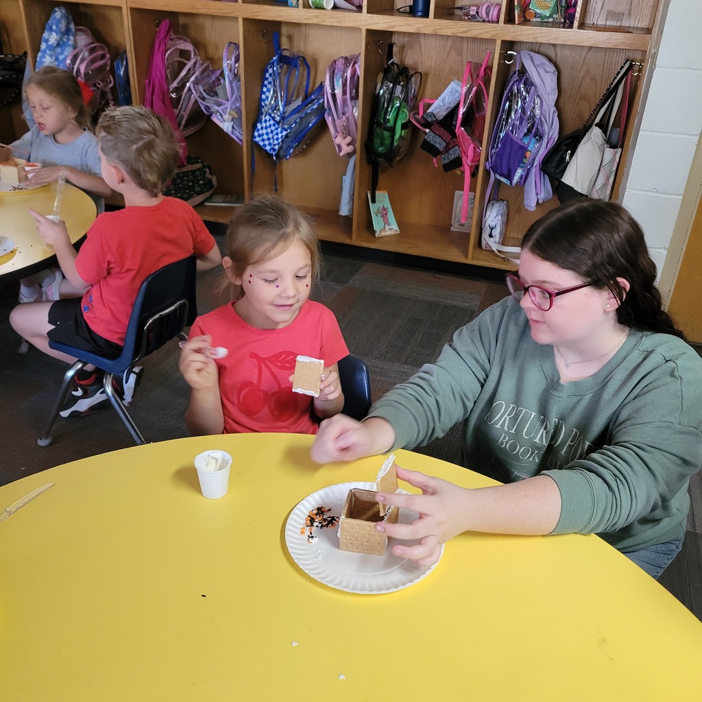 Roland High School culinary students work alongside lower elementary students to create Halloween-themed haunted houses. Students enjoy working together, decorating their houses, and getting creative with their designs.