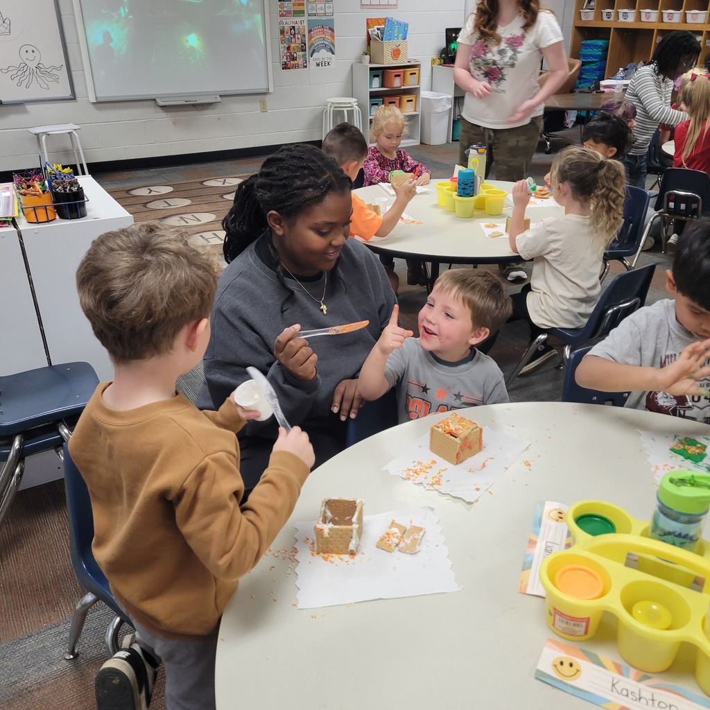 Roland High School culinary students work alongside lower elementary students to create Halloween-themed haunted houses. Students enjoy working together, decorating their houses, and getting creative with their designs.
