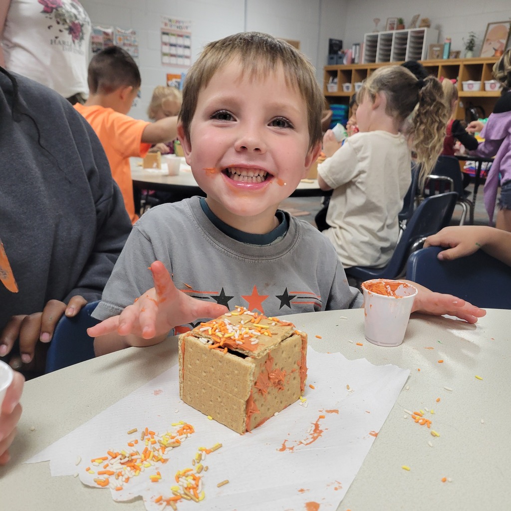 Roland High School culinary students work alongside lower elementary students to create Halloween-themed haunted houses. Students enjoy working together, decorating their houses, and getting creative with their designs.