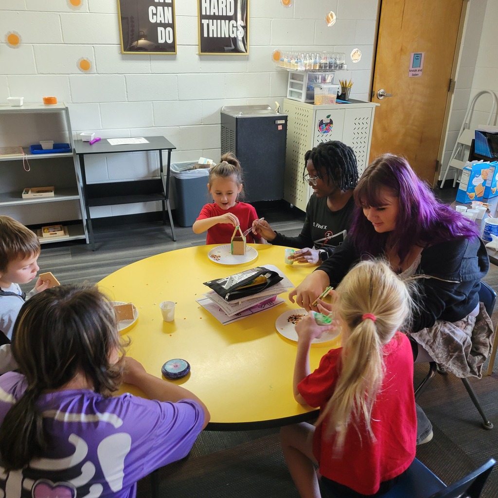 Roland High School culinary students work alongside lower elementary students to create Halloween-themed haunted houses. Students enjoy working together, decorating their houses, and getting creative with their designs.