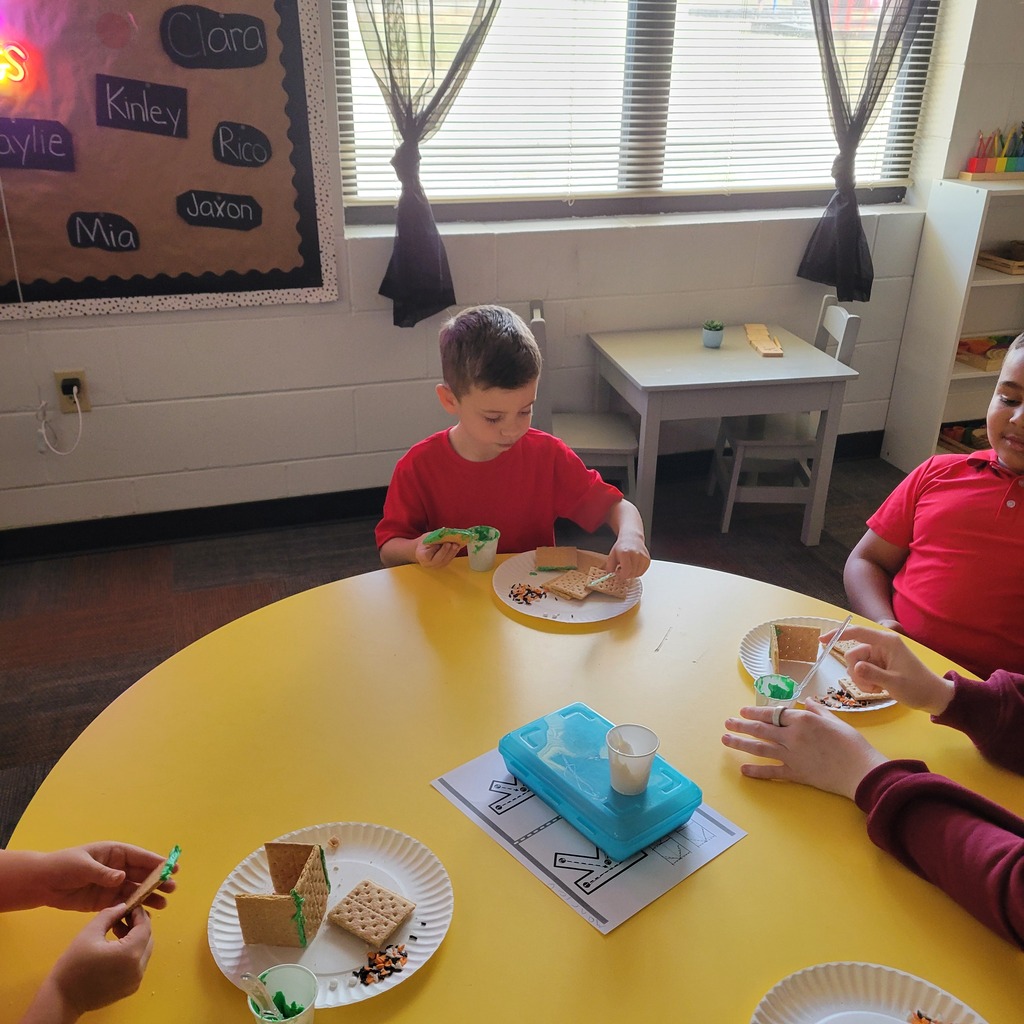 Roland High School culinary students work alongside lower elementary students to create Halloween-themed haunted houses. Students enjoy working together, decorating their houses, and getting creative with their designs.