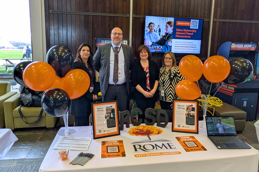 Human Resources team pose at recruiting event