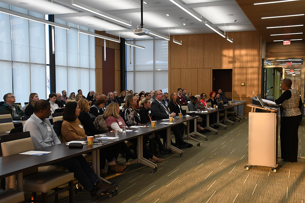 Superintendent Nerlande Anselme speaks to the crowd during the Empowering Futures event.