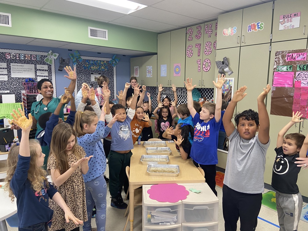 Students participate in a handwashing education session.