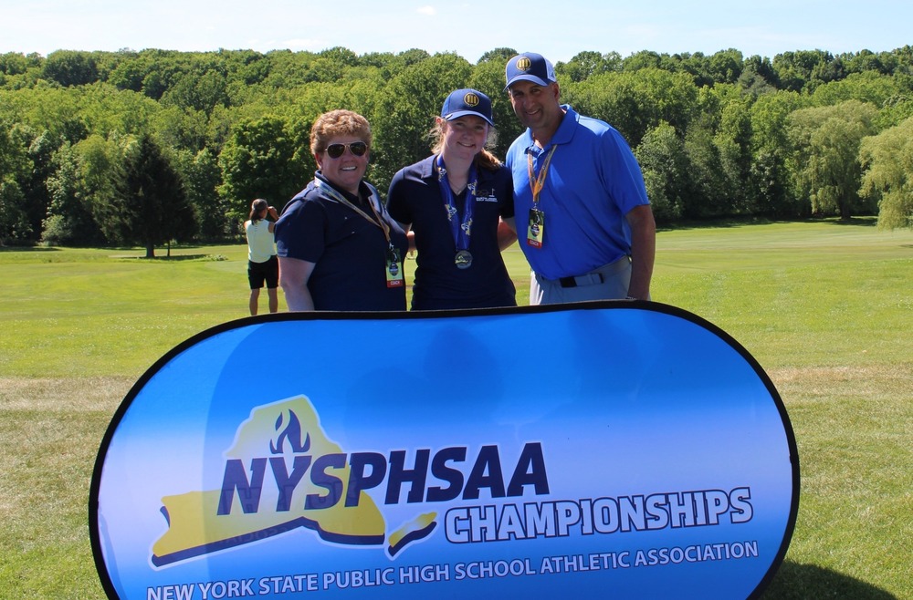 Rachel O'Rourke, center of the photo, poses with Head Coach Dave Petrelli, right, and Assistant Coach Melissa O'Rourke, left, after placing second at the NYSPHSAA Girls Golf Championships.
