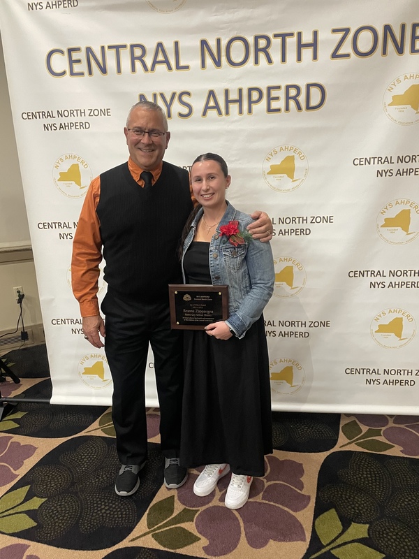 Rome Free Academy Assistant Principal Marty Nemecek congratulates RFA health teacher Reanna Zappavigna on receiving the 2025 NYS AHPERD Joy of Effort Award.