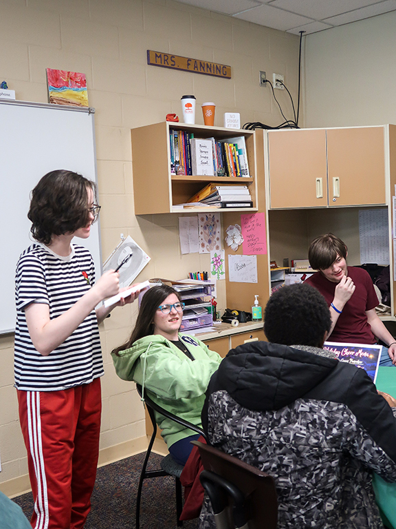 RFA student Emma Snyder takes menu orders during the Christmas party.