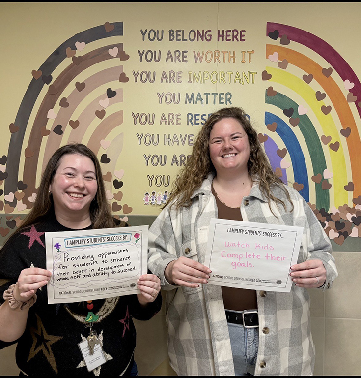 Gansevoort Elementary School Counselors Miriam Rose (left) and Amanda Sanefski (right) pose with their National School Counseling Week signs. 