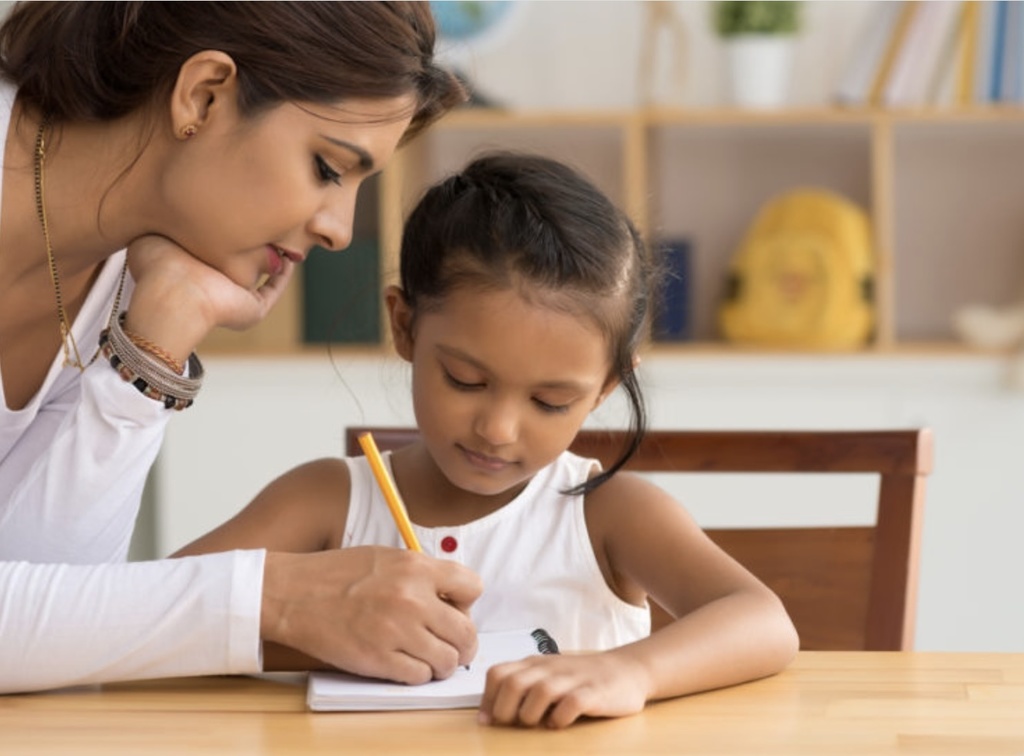 Parent helping child with school work 