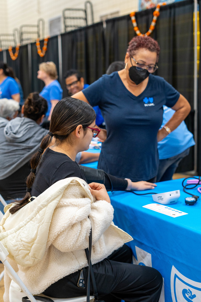 female getting her blood pressure checked