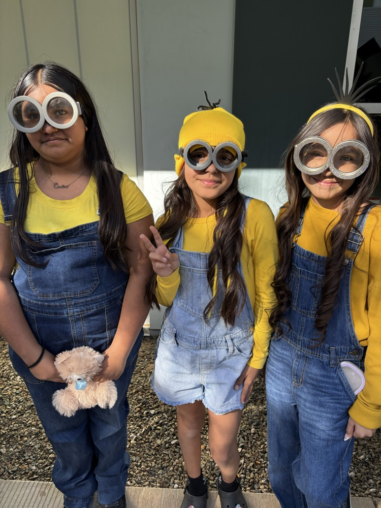 girls dressed in minions constume 