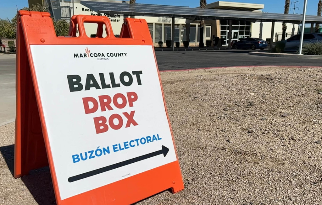 Sign in front of building that reads Ballot Drop Box
