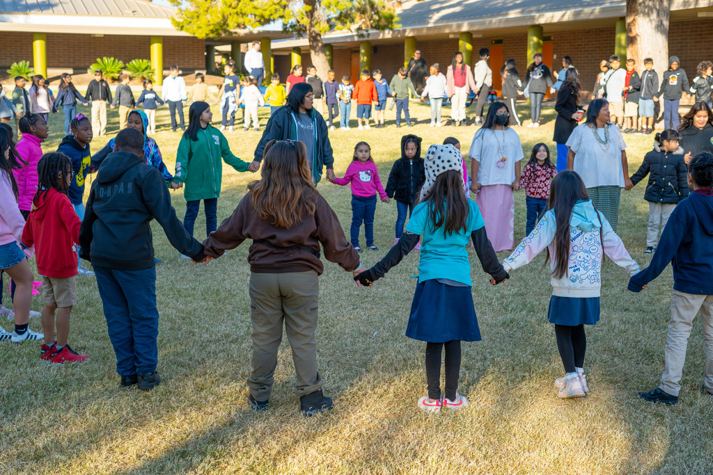 Native American Basket Dancers performing with Roosevelt students
