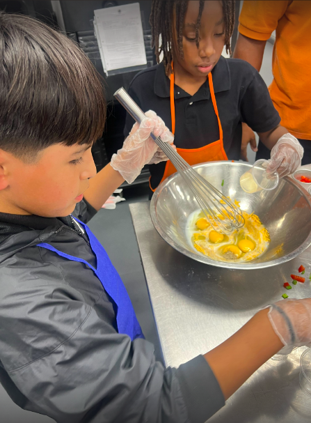 2 boys making dessert