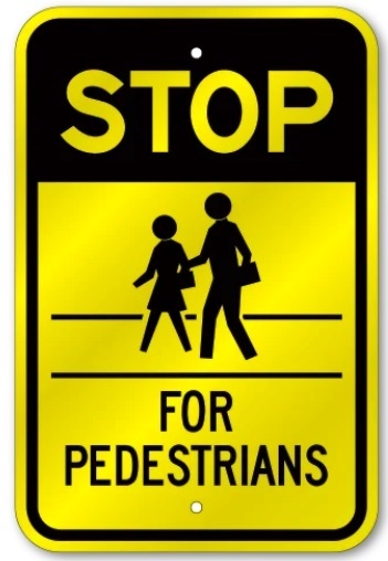 Yellow sign with black strip on top with two people on the front