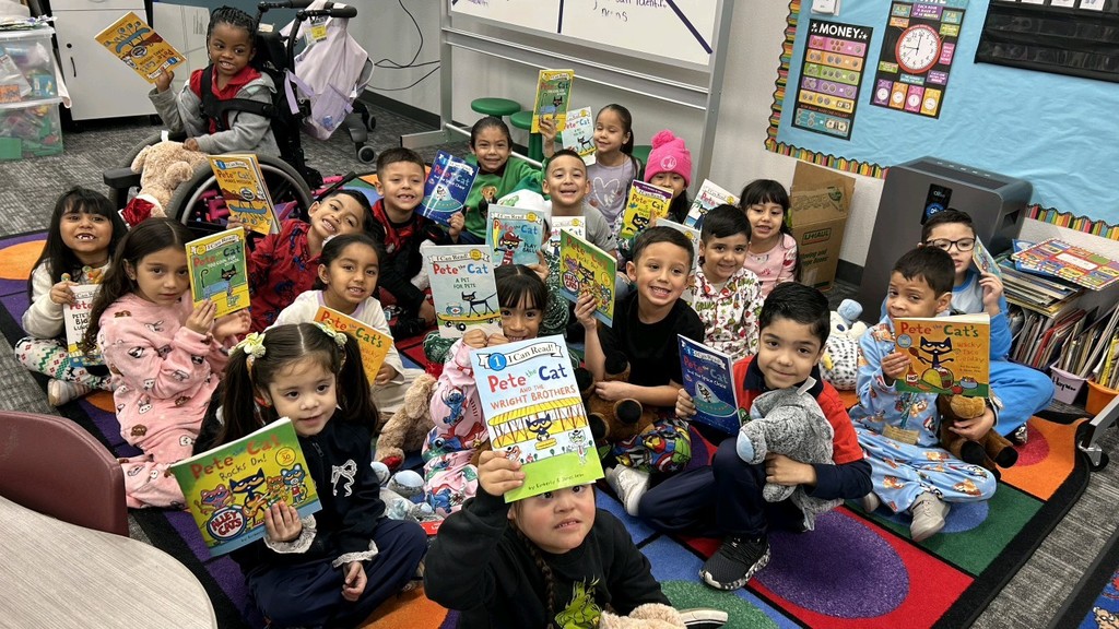 Lampkin's student's showing the books they received for Christmas!