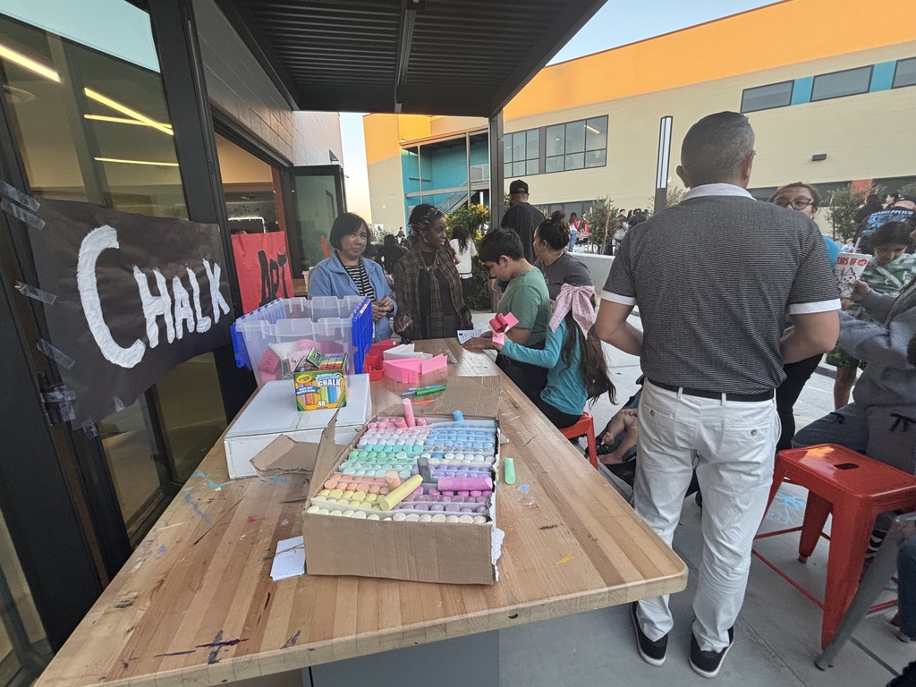 Chalk Art. Table with colorful chalk and activities for the 4th graders