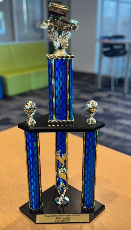 blue trophy with two soccer balls on the sidesresembling the esports ball from the championship game first place symbol.