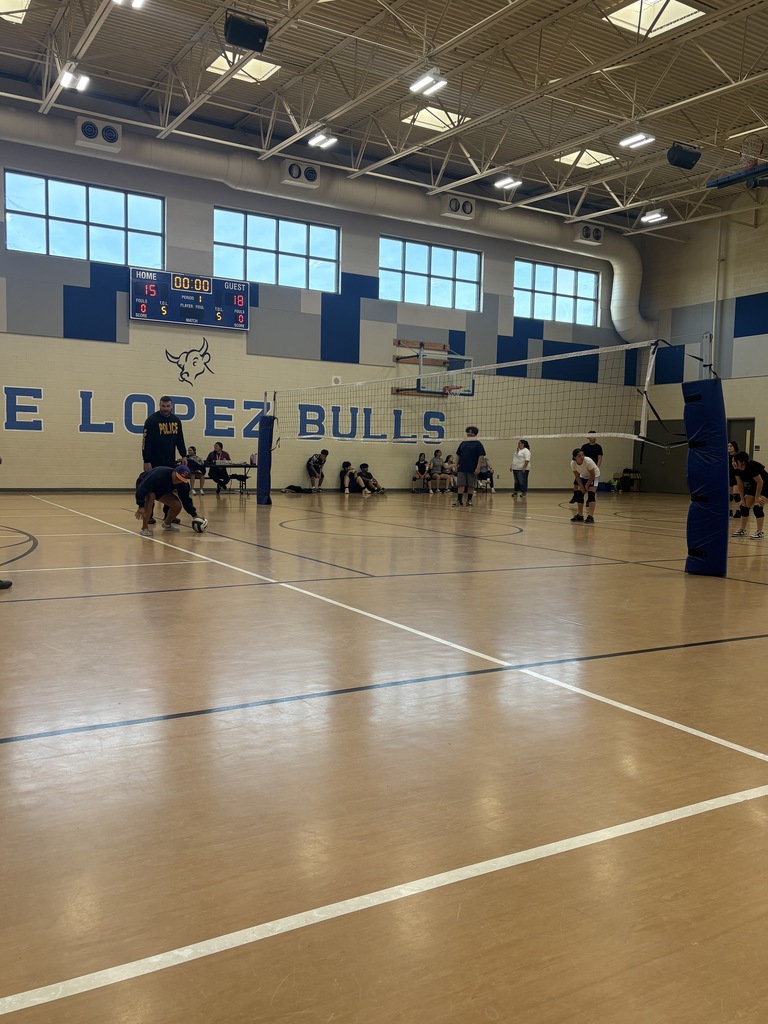 Members of Staff and Phoenix PD in volleyball game