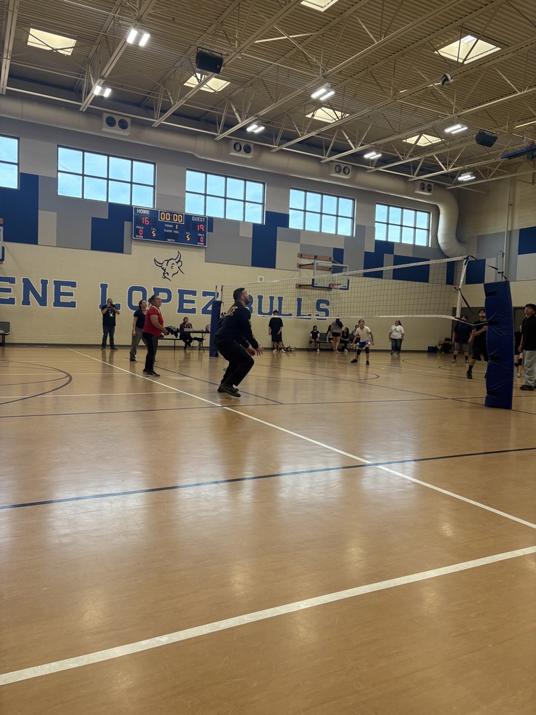 Members of Staff and Phoenix PD in volleyball game