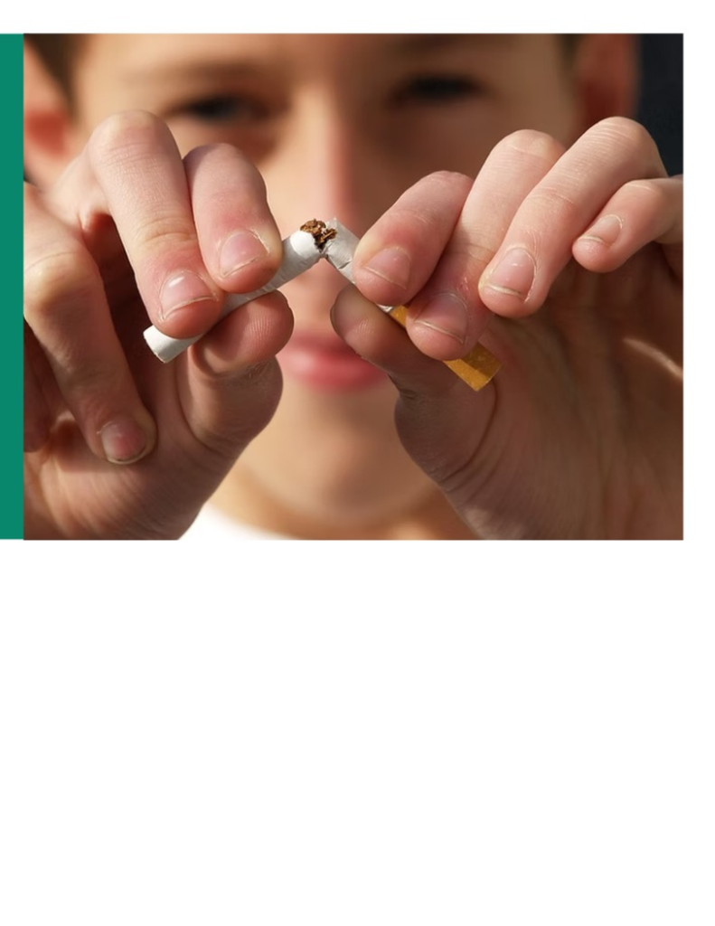 A close-up image of a student breaking a cigarette in half with both hands, symbolizing quitting smoking and tobacco prevention.