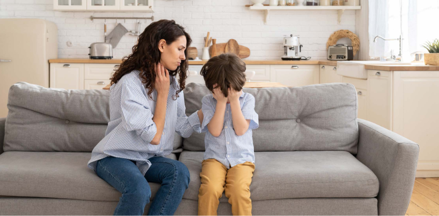 Woman with Upset Child on couch