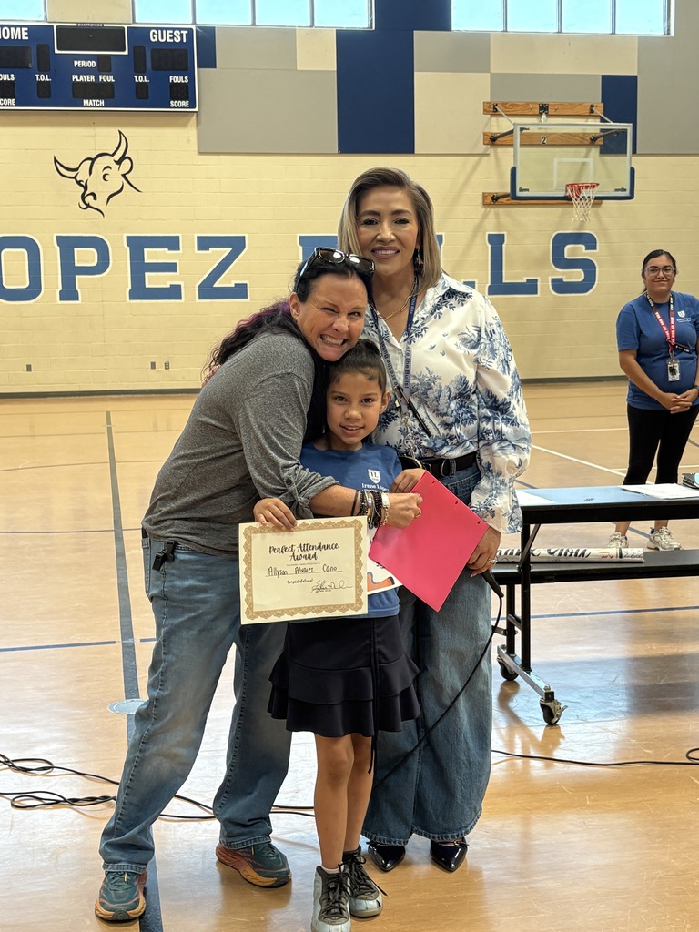Mrs. Miller and Mrs. Garmon with Bulls winner