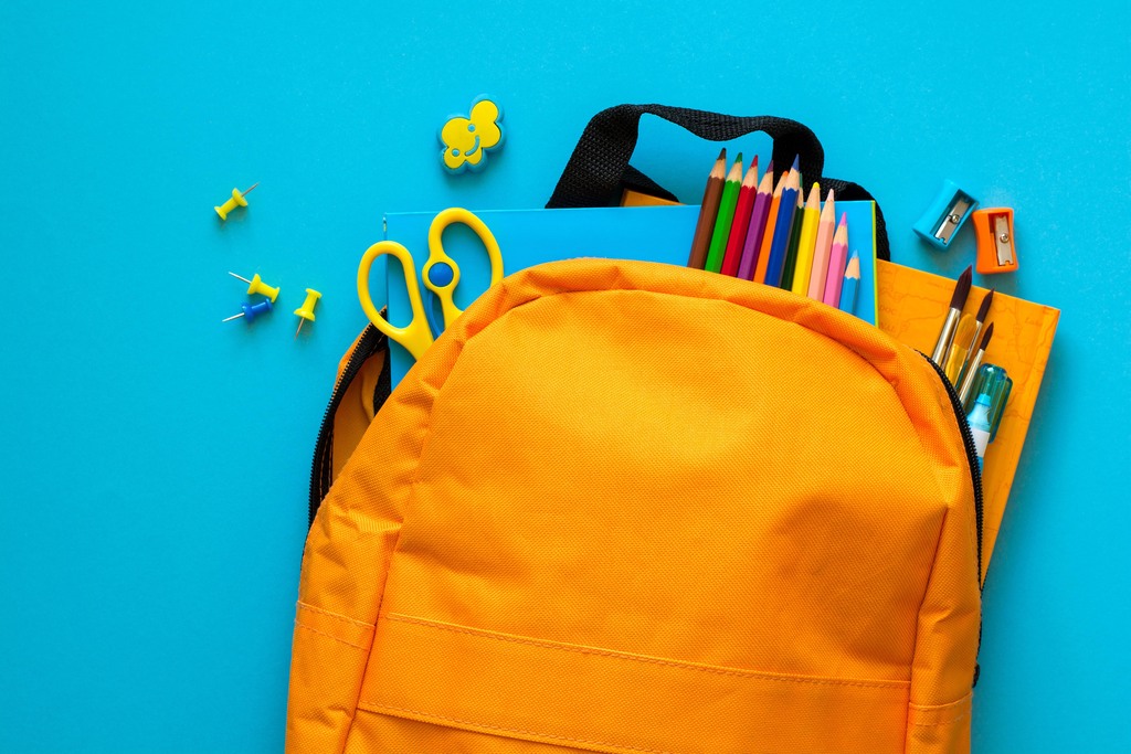 backpack with school supplies in it.