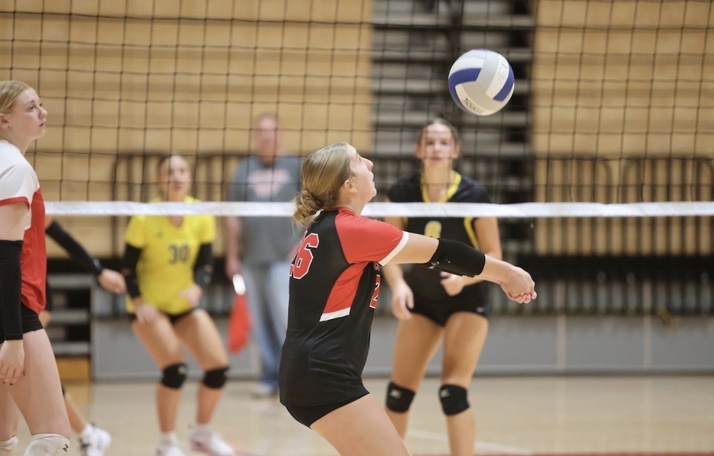 Emme McNaul gets ready to hit the ball.