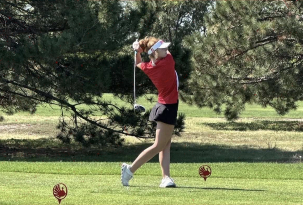 Hannah Reeves finishing her swing.