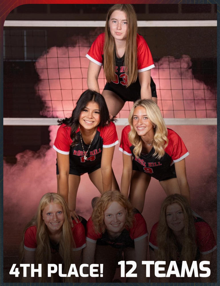 Volleyball players in a pyramid announcing their win.