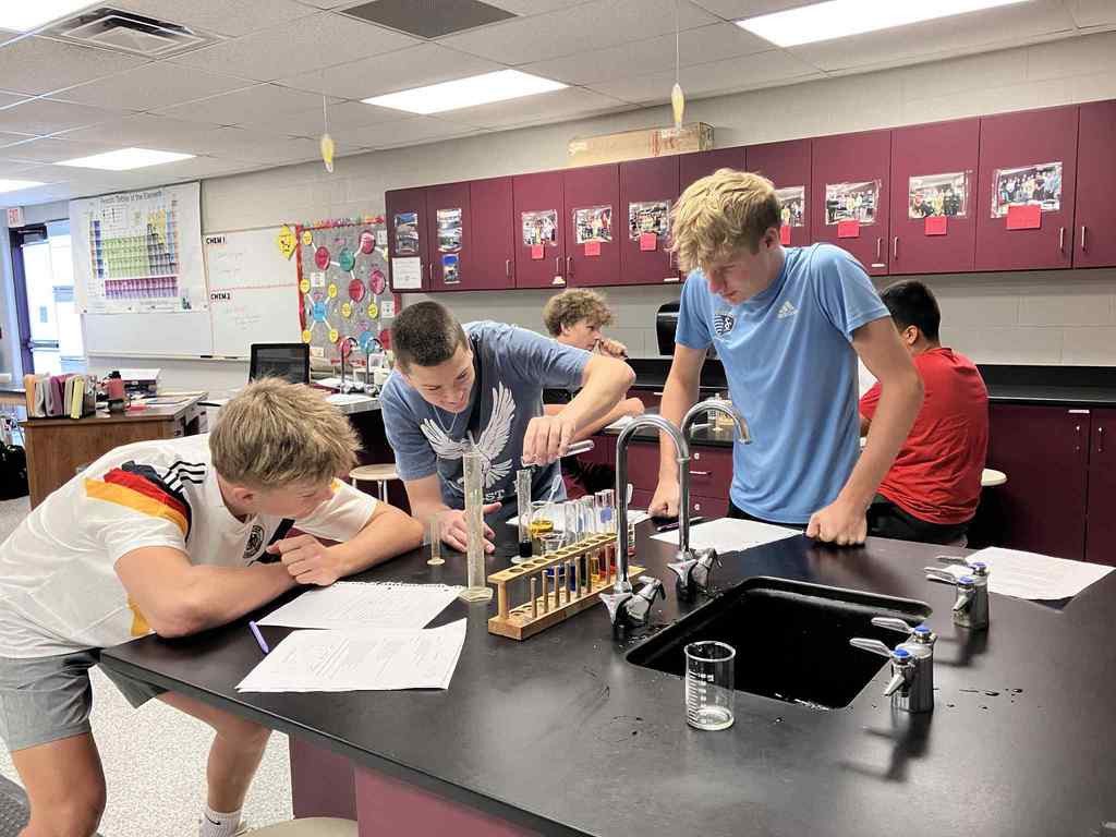 Boys learning in Chem class