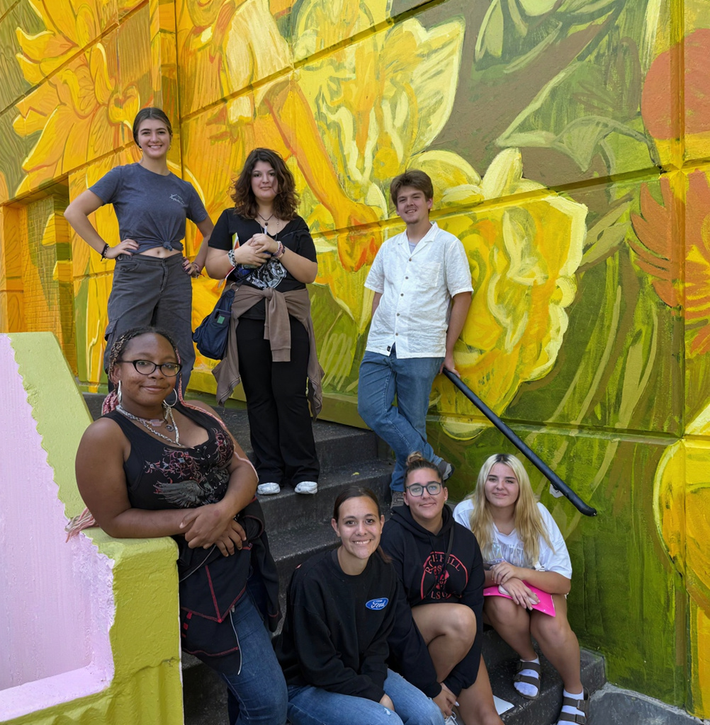 Choir Students at WSU, sitting on steps